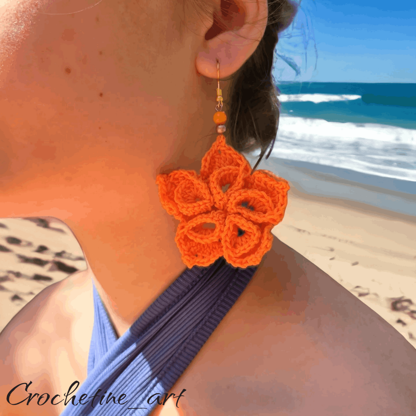 Boucles d'oreilles fleur au crochet de couleur orange avec perles intermédiaires 